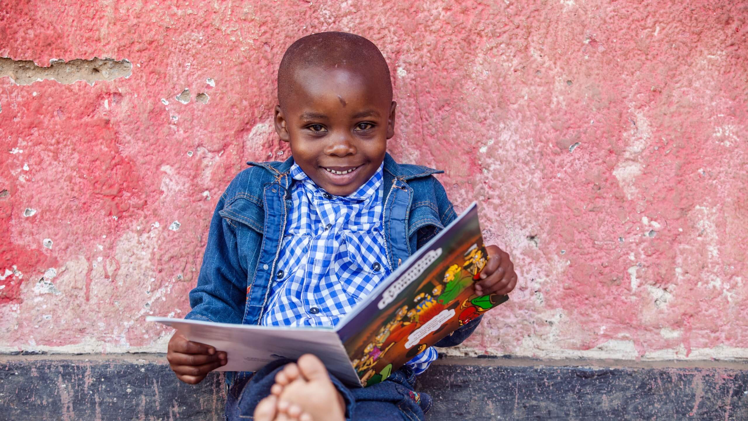 Eritier*, 7, plays with this brothers outside his home