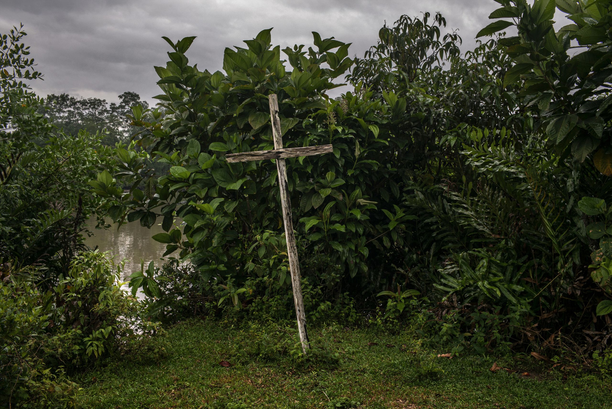 A cross can be seen along a river.