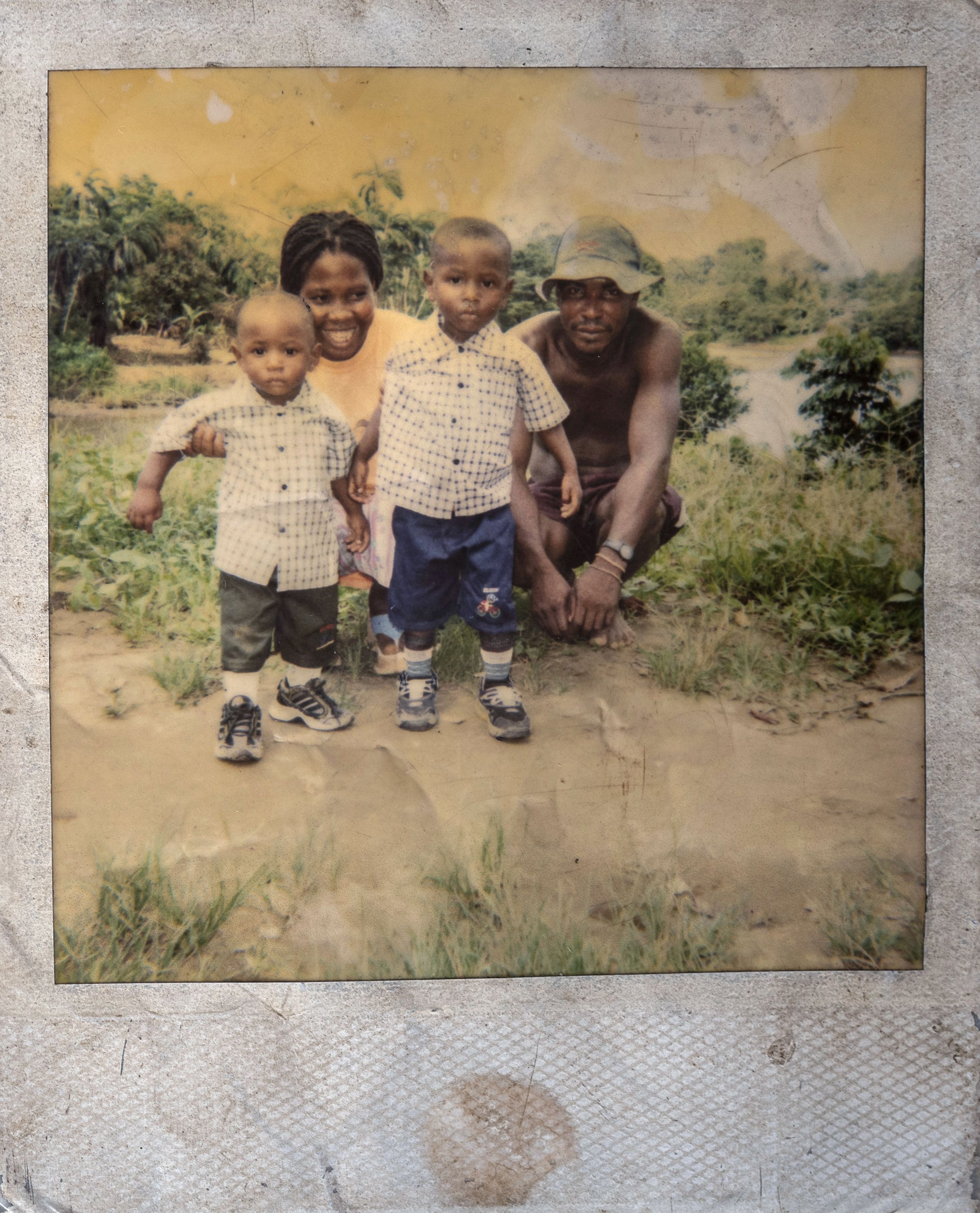 A polaroid picture of 4 year old José David Rios (right) with his mother, father and little brother who later died of cancer.